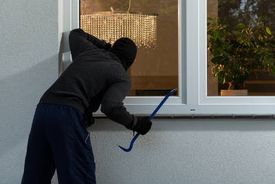 Burglar impacting a window