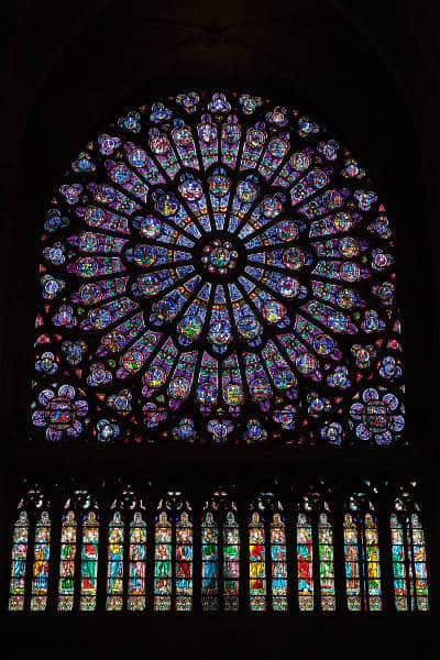notre dame cathedral's rose window and saints