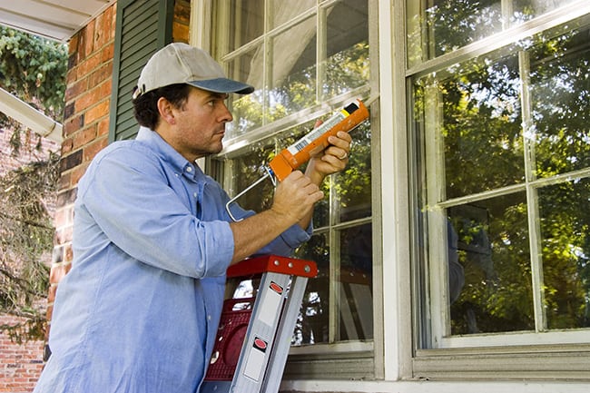 man does home improvement around the house