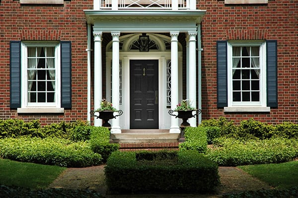 red brick house with a front entry door