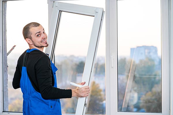 professional window installer at work